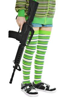 lower part of the teen girls in colorful clothes with a gun in his hand
