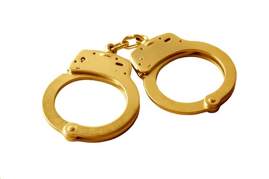 A pair of gold handcuffs against white background