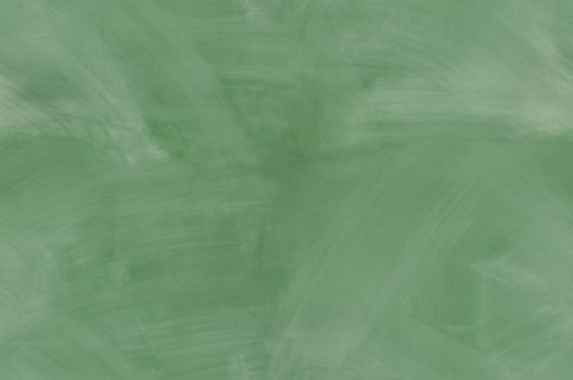 Green chalkboard with smeared chalk eraser marks seamlessly tileable