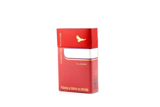 Red box of cigarettes on white background