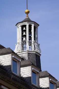 The Bell Tower of a church glows in the warm afternoon sun