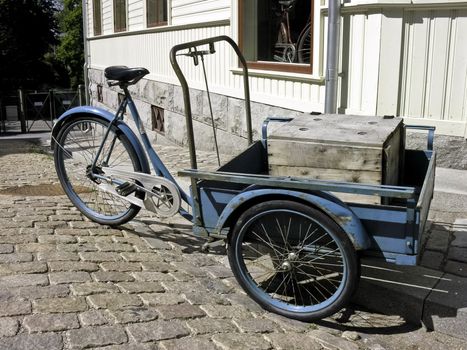 Old Norwegian traditional tricycle with a cargo inside