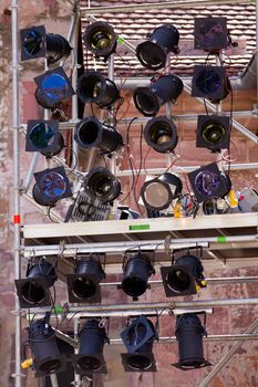 Event lights and spotlamps on a metal frame ready for a show