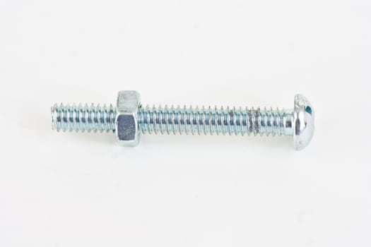 A long bolt with a nut just started on a white background.