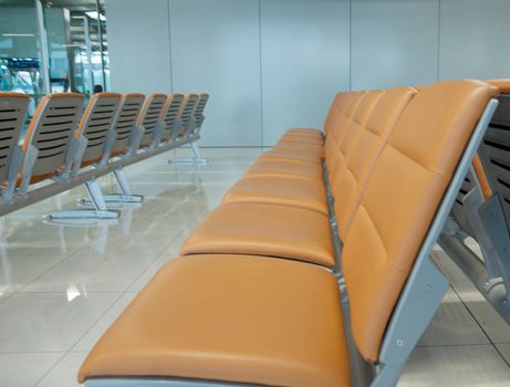 orange airport or bus waiting seats in rows