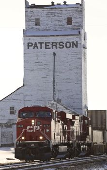 Train passing Parkbeg grain elevator in winter