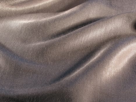 Abstract grey silk background, cloth is bedded by waves