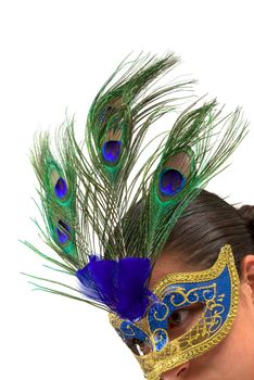Gilr wearing a mask made out of peacock feathers