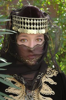 Ethnic girl wearing Middle Eastern clothing                               