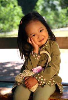 The beautiful Korean girl covered by the sun