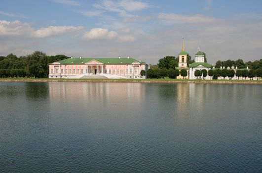 Old rich manor on coast of a reservoir