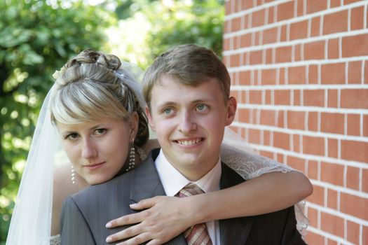 Happy newly-married couple on walk in park