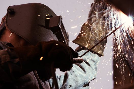 a metal welder busy at work