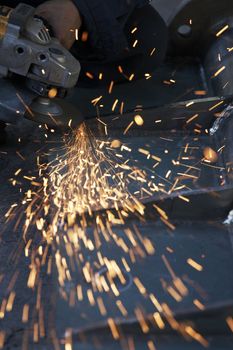 a picture of metal sparks coming from a grinder