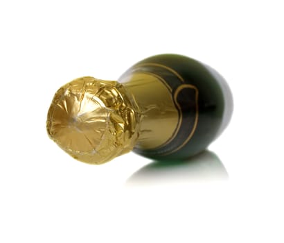 The champagne bottle lays on a white background. Isolation. Shallow DOF