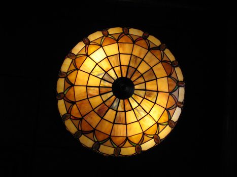 restaurant lighting - looking up at the stained lass