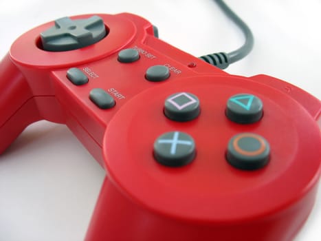 a red video game controller isolated over white
