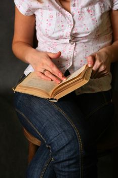 Female hands with the old book