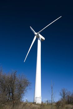 wind turbine against clear blue sky