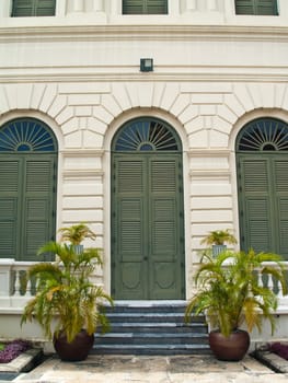 Classic style building with golden cane palm in Grand Palace, Bangkok, Thailand