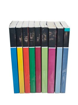 Isolated stacks of colorful real books on white background