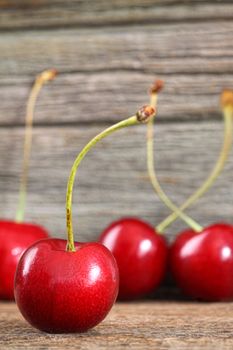 Red cherries on old barn wood