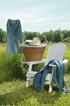 Jeans hanging on clothesline with blue sky