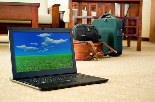 notebook (laptop) on a background of Hotel interior. monitor image belongs to me. 