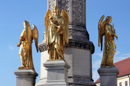 Golden angels on monument of holly Mary in front of Zagreb main cathedral