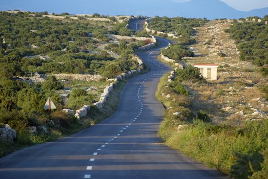 Asphalt winding road, Island of Pag, Croatia.