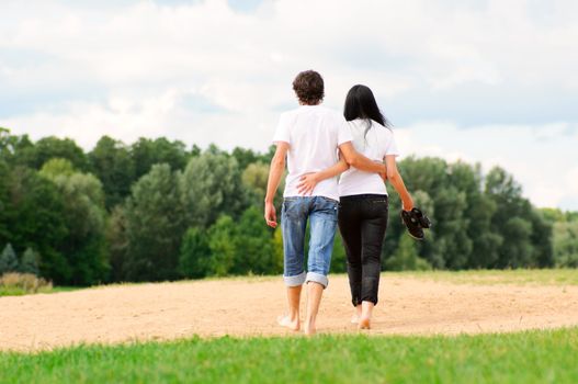 Happy young couple enjoying at beach