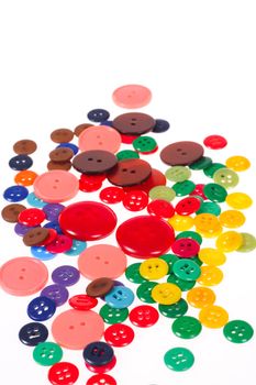 Many different sized and shaped buttons photo on white background