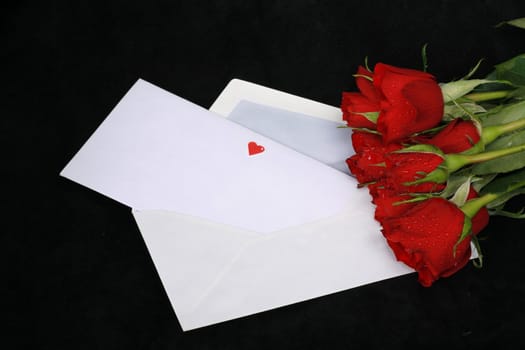 a loveletter on a dark background with rose and heart...........