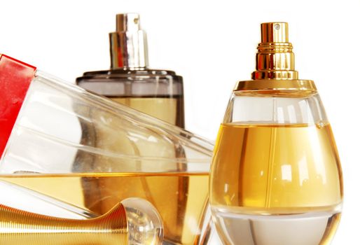 group of several perfumes in glass bottles over white background