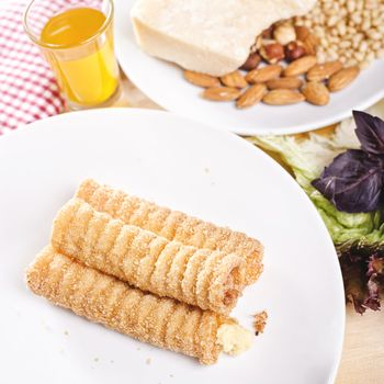 pancakes with cheese on a white plate