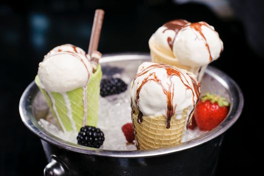 Ice cream in an ice bucket and fruit