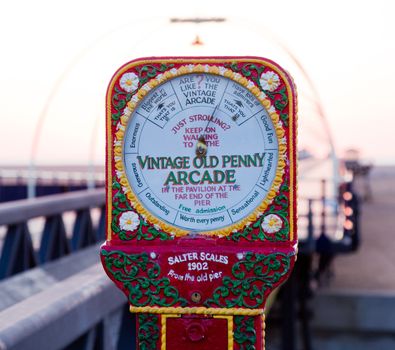 Antique scales on entrance to Southport Pier in Lancashire, England