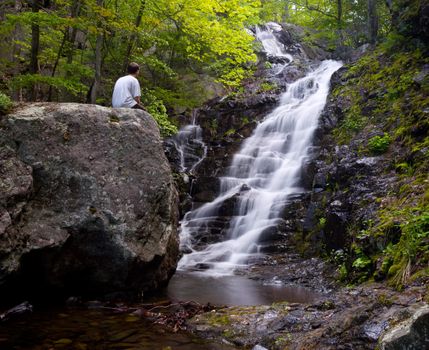 Overall Run waterfall is the highest waterfall in Virginia if its sections are taken into account. Hiker overlooking the falls