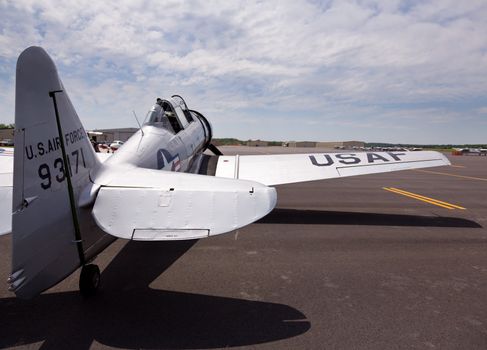 AT-6 Texan, known as the Harvard training plane on runway