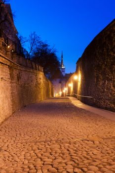 Cobbled street leaving Toompea area of Tallinn in Estonia at dusk