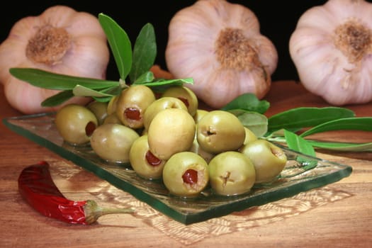 olives with olive branch and hot pepper and garlic