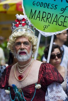 NEW YORK -  JUNE 26 : An unidentified participant celebrates gay pride parade after passing the same sex marrige bill in New York city on June 26 2011.