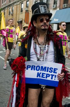 NEW YORK -  JUNE 26 : An unidentified participant celebrates gay pride parade after passing the same sex marrige bill in New York city on June 26 2011.