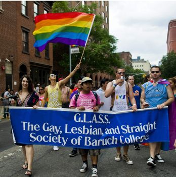 NEW YORK -  JUNE 26 : An unidentified participants celebrates gay pride parade after passing the same sex marrige bill in New York city on June 26 2011.