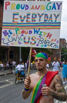 NEW YORK -  JUNE 26 : An unidentified participant celebrates gay pride parade after passing the same sex marrige bill in New York city on June 26 2011.