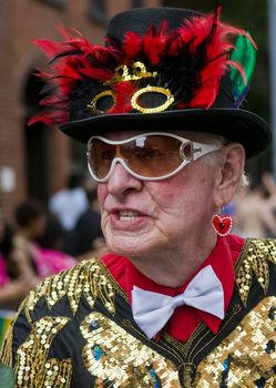 NEW YORK -  JUNE 26 : An unidentified participant celebrates gay pride parade after passing the same sex marrige bill in New York city on June 26 2011.