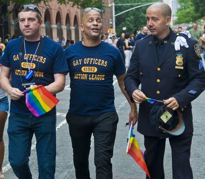 NEW YORK -  JUNE 26 : An unidentified three gay police officers celebrates gay pride parade after passing the same sex marrige bill in New York city on June 26 2011.