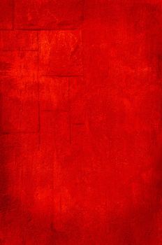 Closeup of a stonewall in red.