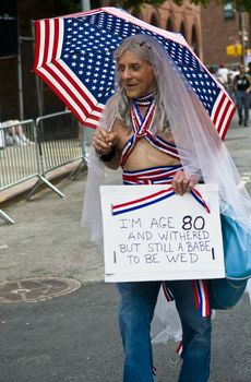 NEW YORK -  JUNE 26 : An unidentified participant celebrates gay pride parade after passing the same sex marrige bill in New York city on June 26 2011.