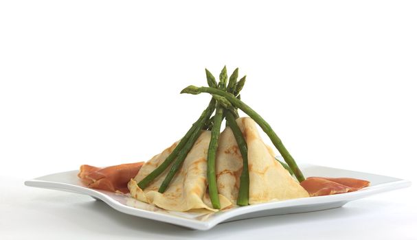 Crepes and asparagus tipi with ham on the sides (Selective Focus, Focus on the top)